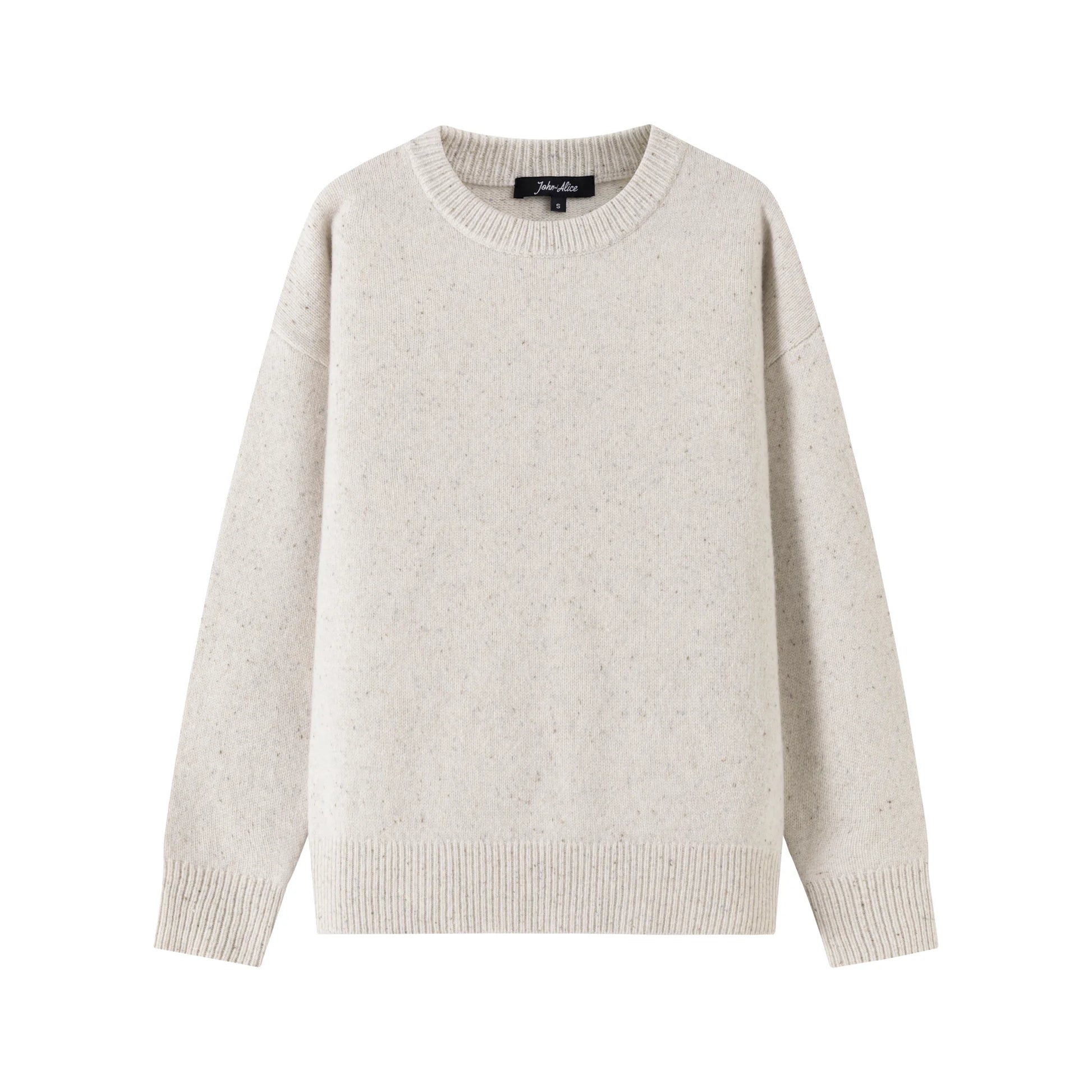 Front view of an oatmeal jumper with a crew neck, ribbed trims and a slightly oversized fit.