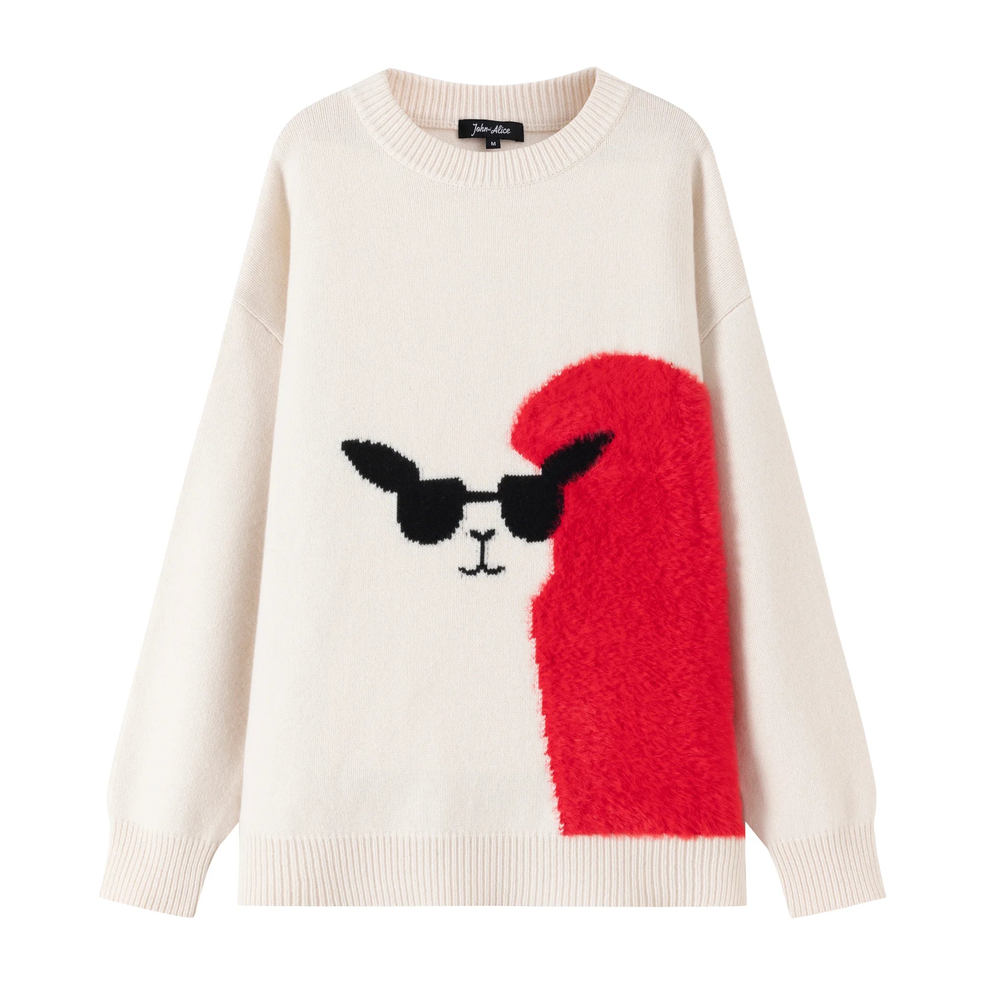Front view of a cream oversized intarsia jumper with a llama face motif, black sunglasses and a bright red fuzzy heart panel.