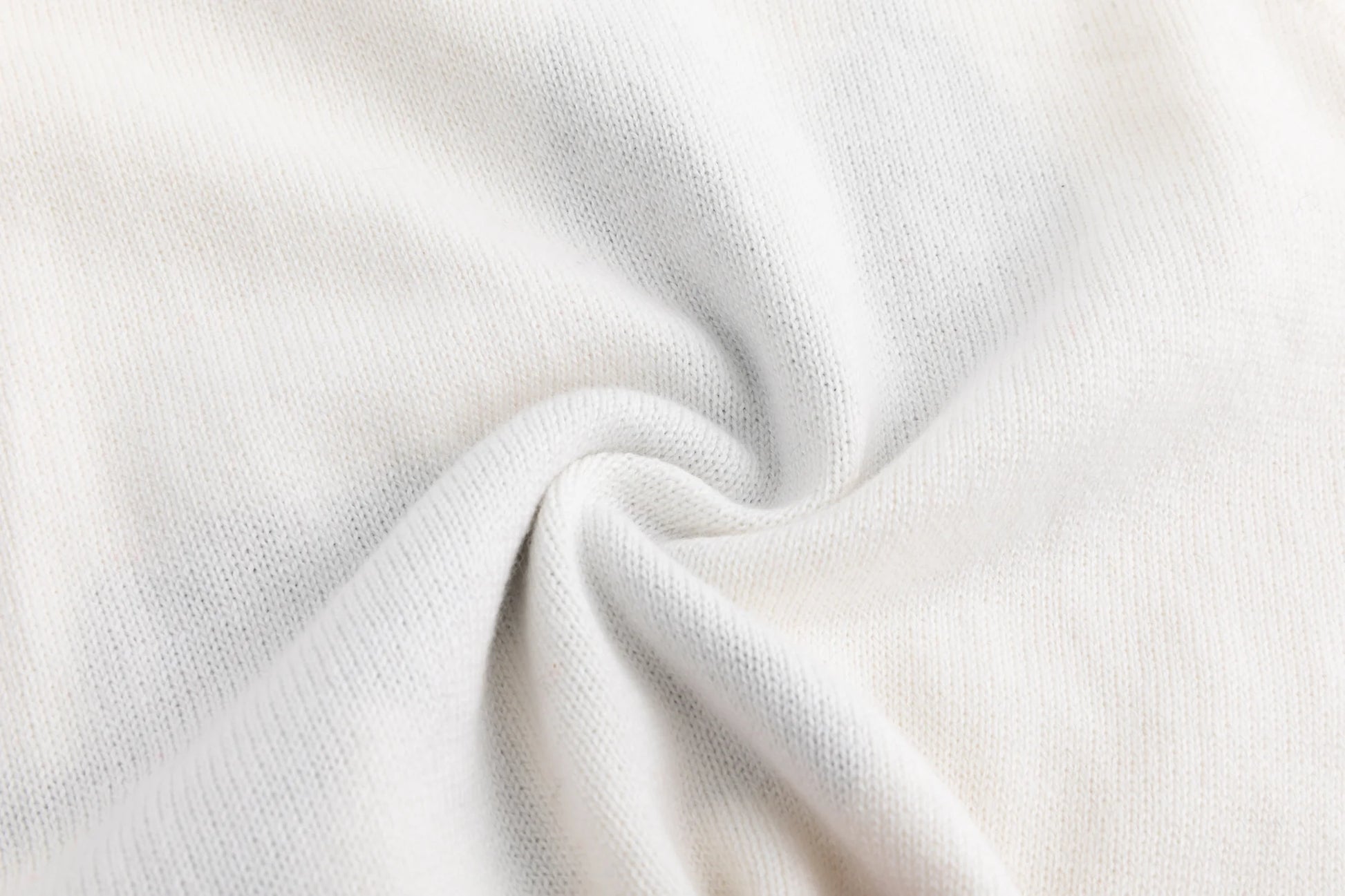 Close-up of the soft knit texture on the ivory tank.