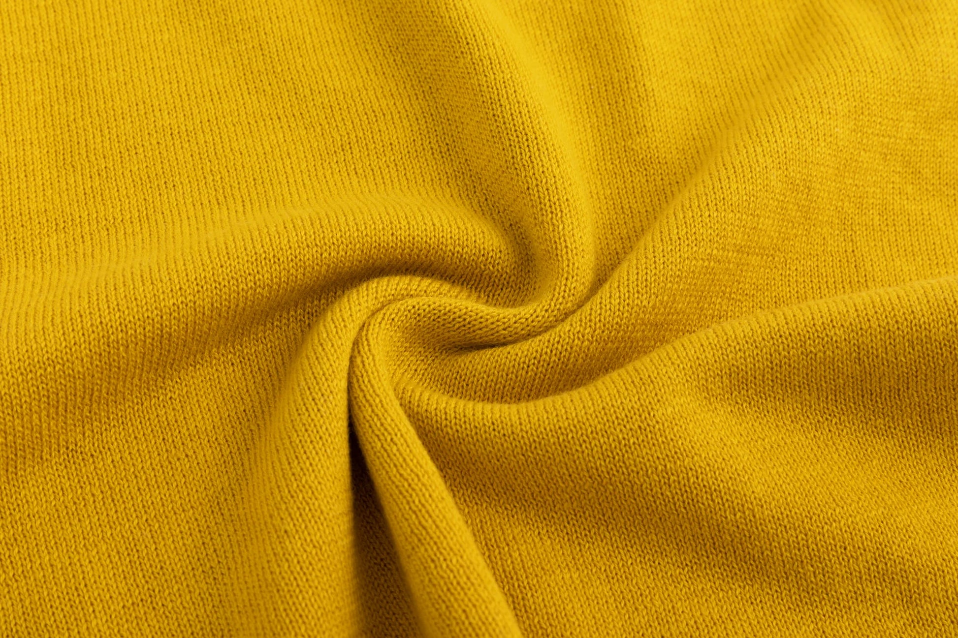 Close-up of the cotton knit texture on the mustard yellow tank.