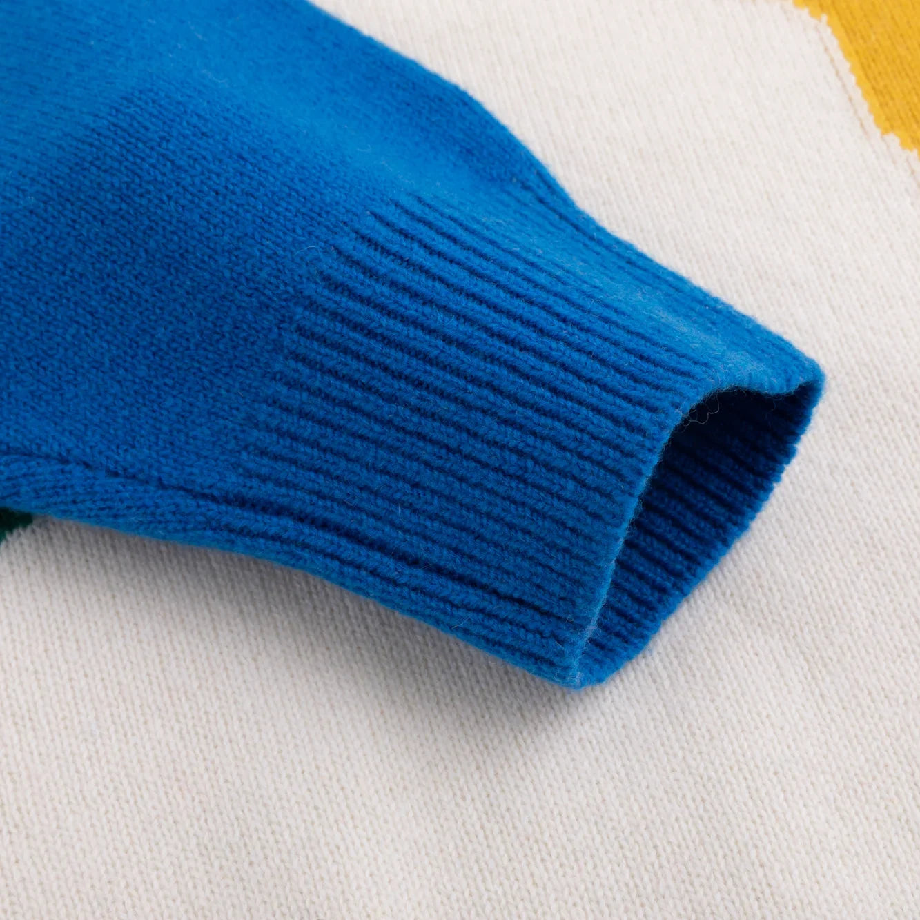 Close-up of a bright blue ribbed knitted cuff