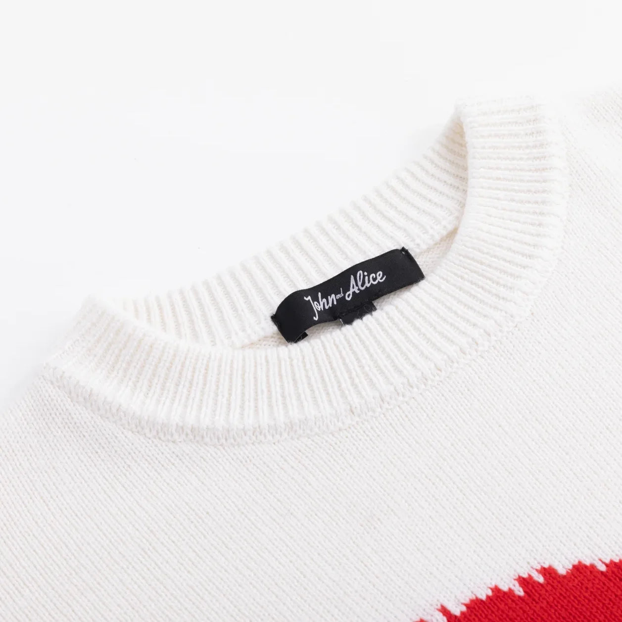 Ivory ribbed crew neckline with John and Alice label