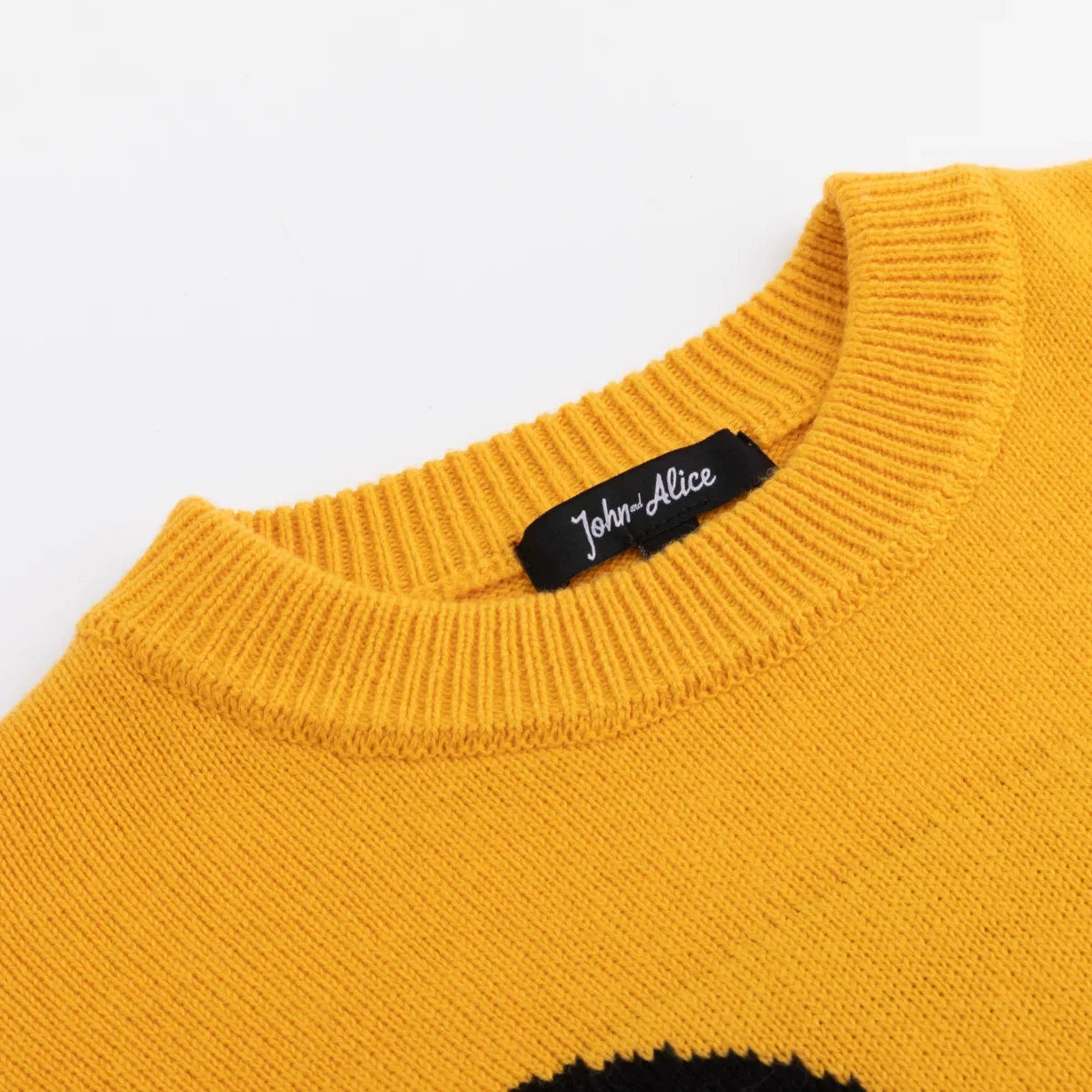 Mustard yellow ribbed crew neckline with John and Alice label