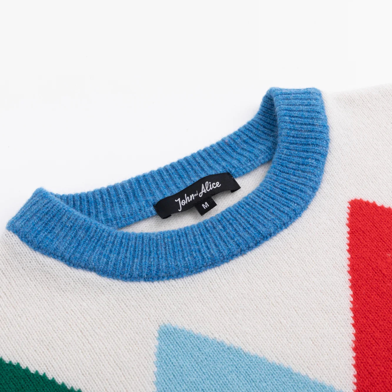 Blue ribbed crew neckline with John and Alice label