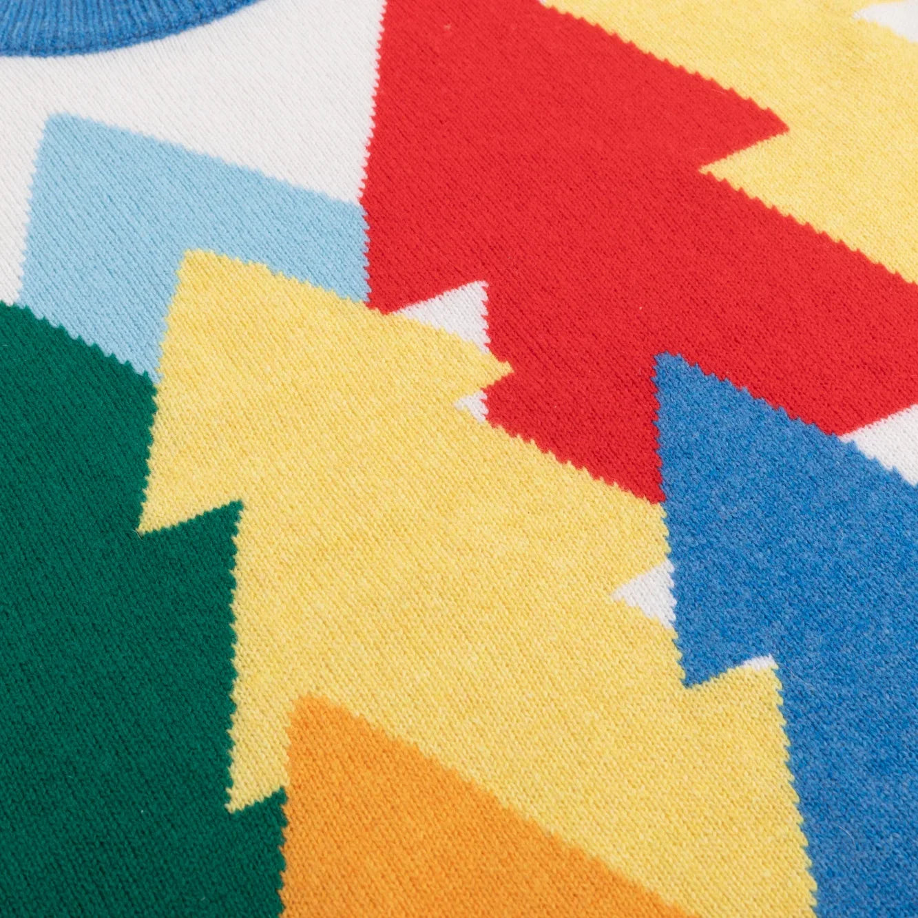 Colourful red, yellow, green and blue tree pattern on ivory knit