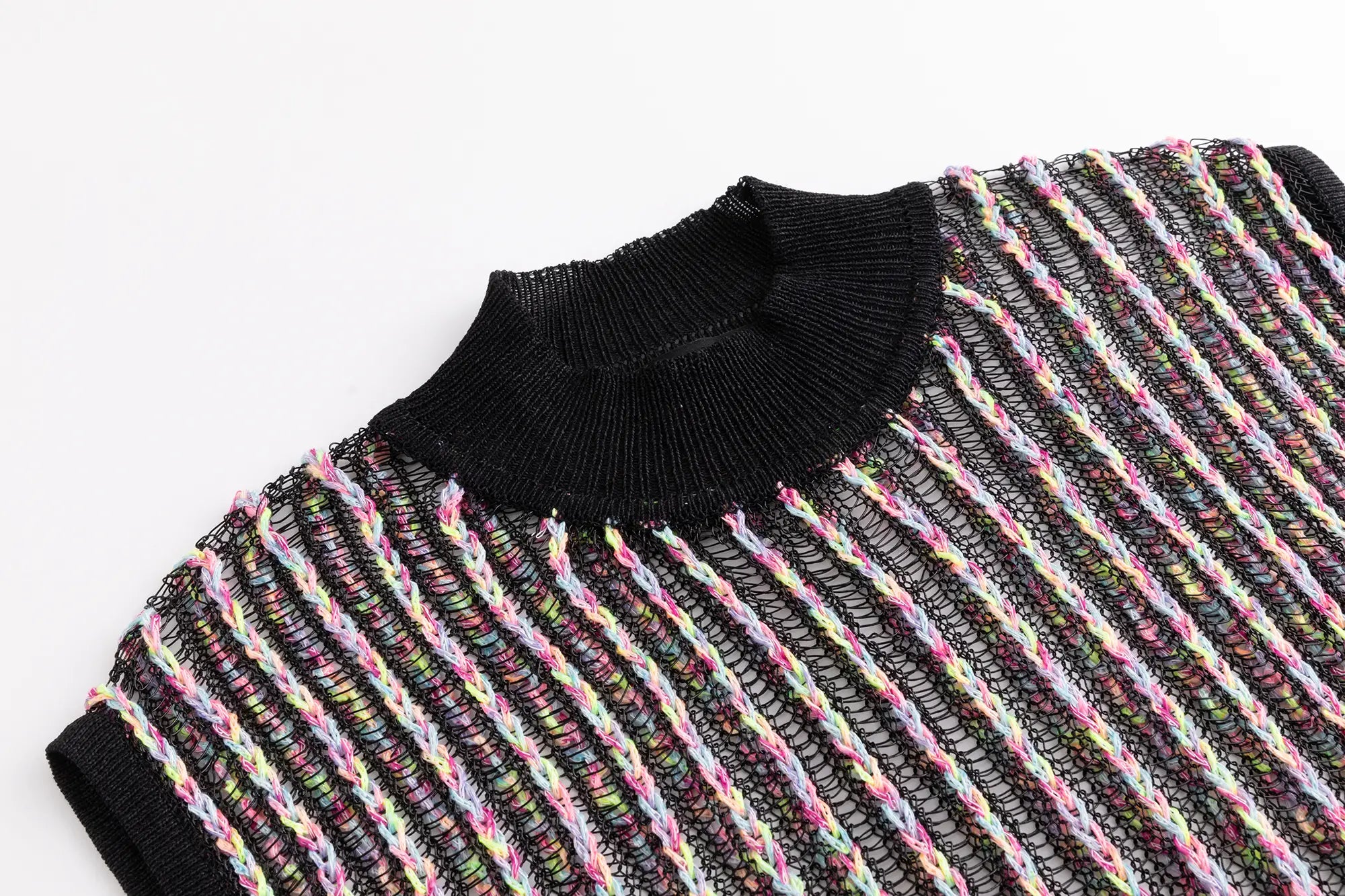 Close-up of the mock neckline on the black multicolour crochet top with vertical striped texture.