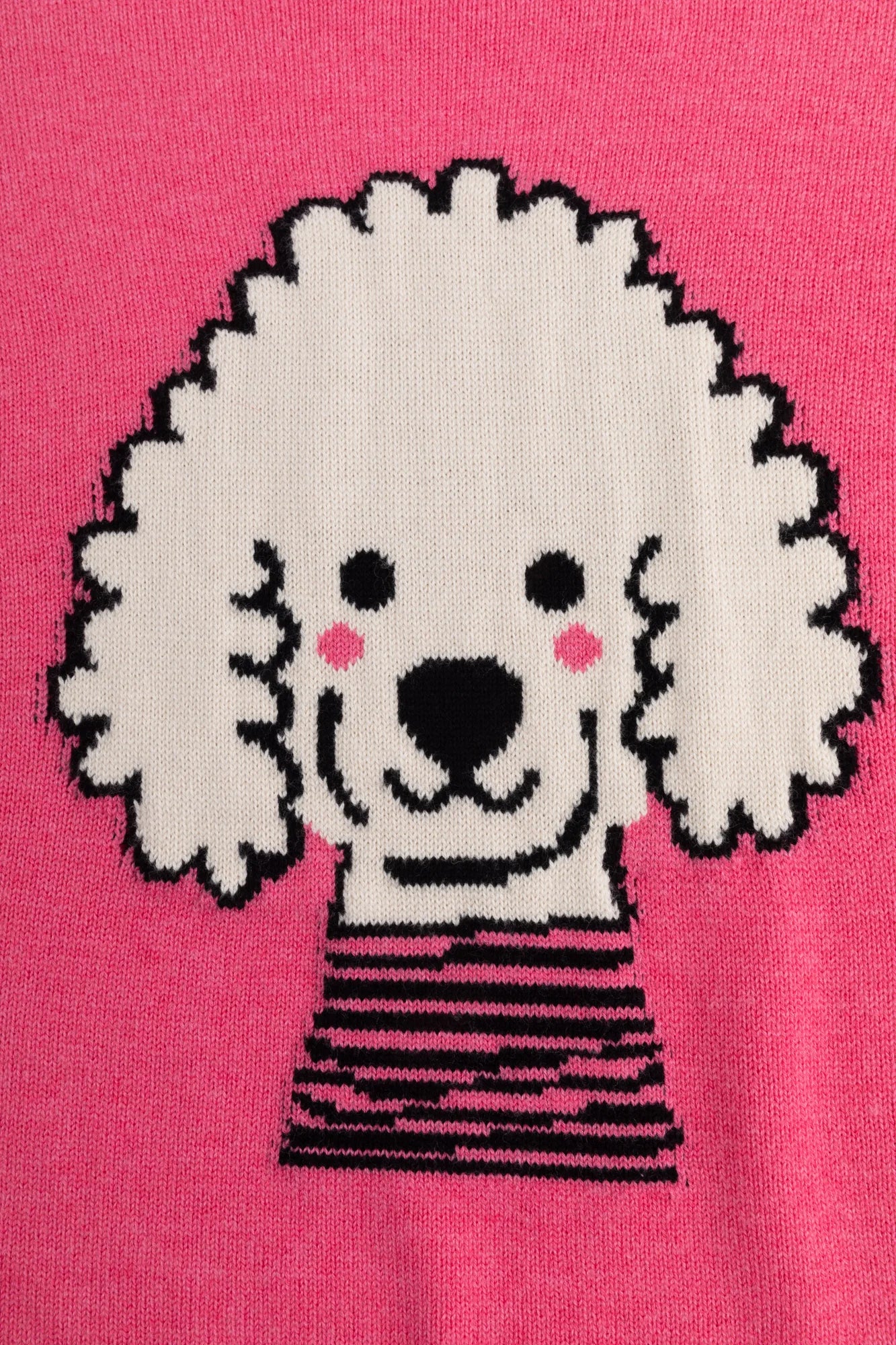 Close-up of the teddy dog jacquard on the pink jumper.